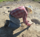 Joe Taylor cleans track with brush